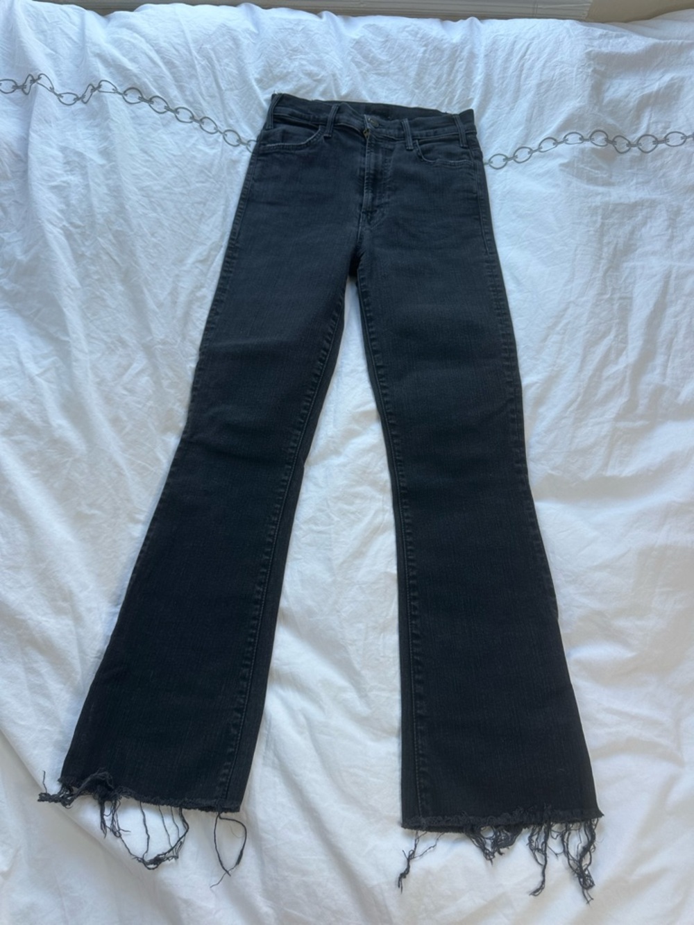 MOTHER Black Flare Jeans with Distressed Hem